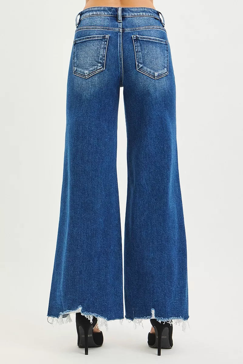 RISEN High Rise Wide Leg Jeans with Distressed Hem.